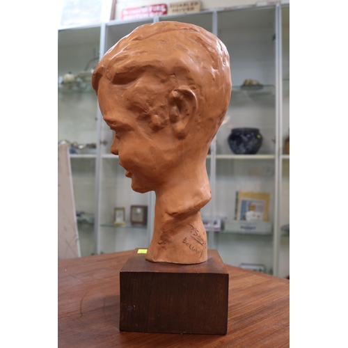 3 - Paul Serste Belgian 1910 - 2000, Terracotta bust of a young boy 36cm in Height signed to base