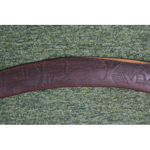 41 - Large Australian Boomerang with native animal carving. 90cm in Length