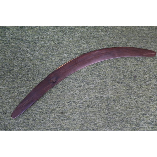 41 - Large Australian Boomerang with native animal carving. 90cm in Length