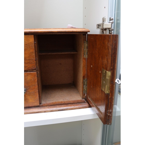 56 - Oak Cased Edwardian smokers Cabinet with drop handles and applied shield - complete with Key