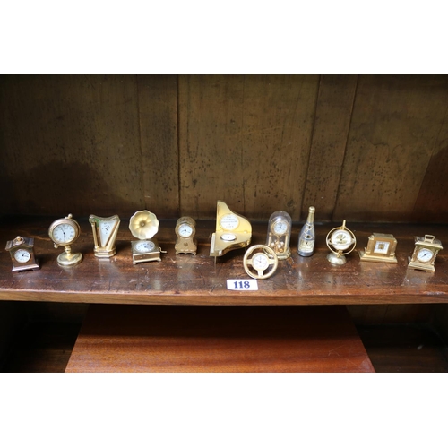 118 - Collection of 12 gilt miniature clocks in various forms.