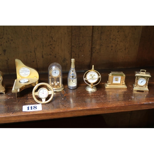 118 - Collection of 12 gilt miniature clocks in various forms.