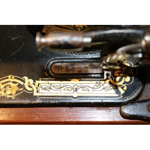 201 - Mahogany cased Singer Sewing machine R303377