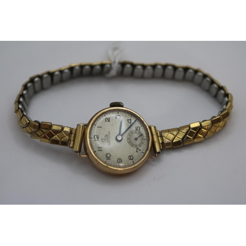 373 - Record 9ct Gold Cased wristwatch with numeral dial on expanding bracelet