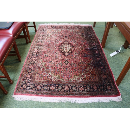 420 - Good quality Silk Red ground rug with central medallion and tassel ends 218cm x 139cm