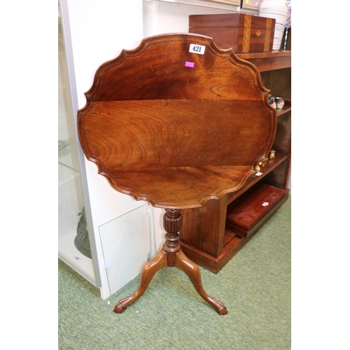 421 - Walnut piecrust tilt top wine table on turned and fluted stem over tripod base