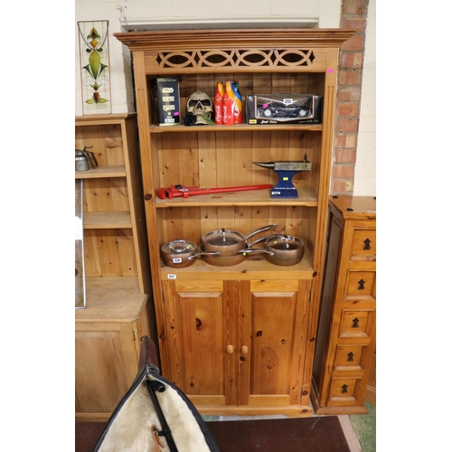 447 - Tall Pine bookcase with panelled cupboard base