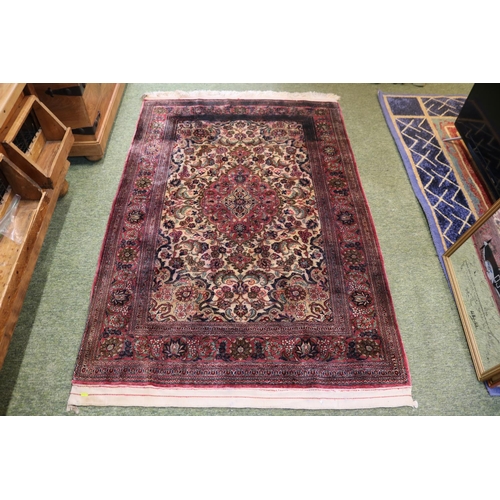 469 - Good quality Red Ground Persian Silk Rug with central medallion and floral borders and tassel end 17... 