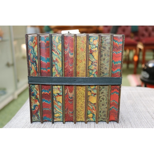 84 - Antique Huntley & Palmers biscuit tin in the form of eight bound books.