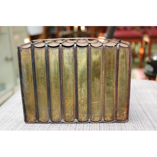 86 - Antique Huntley & Palmers biscuit tin in the form of eight bound books.