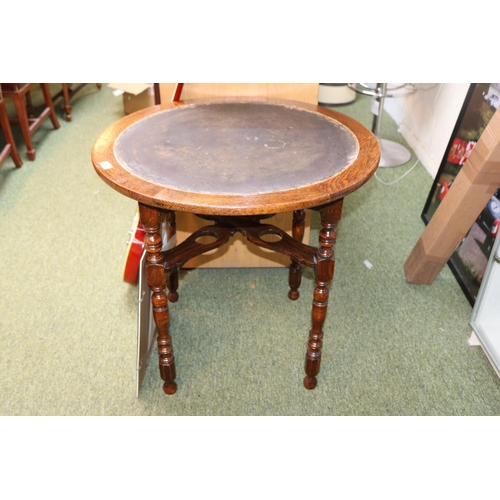 482 - Oak Circular table on turned supports with cruciform gallery