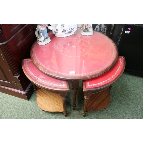 513 - Leather topped circular table and a nest of tables to base