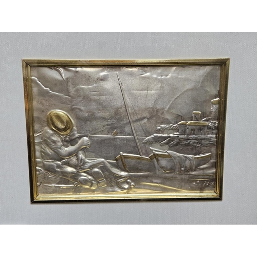 86 - Framed and mounted Silver plaque depicting a Mediterranean fisherman mending nets against shoreline ... 