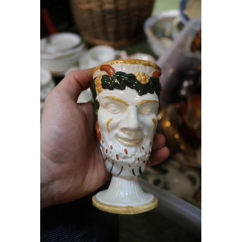 110 - 2 Boxes of assorted ceramics to include a Pratt ware Bacchus face mask mug, with moulded frog to the... 