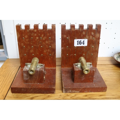 164 - Pair of Oak bookends with canon decoration