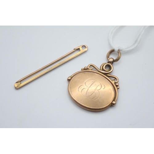 282 - 9ct Gold Tie Bar and a Early 20thC 9ct Gold Rotating watch chain fob 7.8g total weight