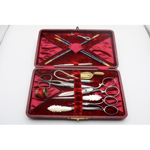 348 - Good quality Cased travelling sewing set in Red Leatherette case