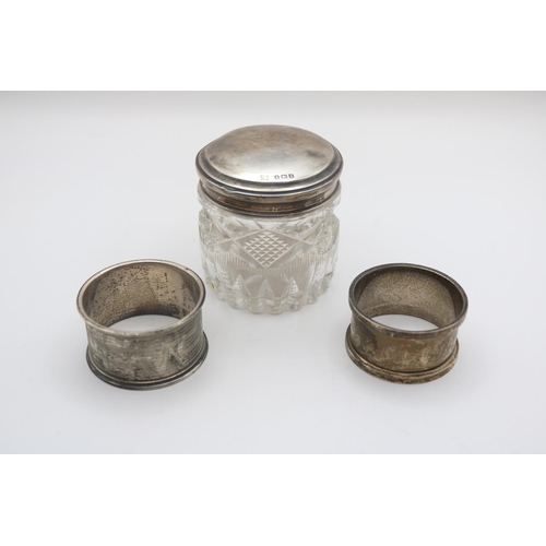 354 - Silver topped cut glass powder jar and 2 Silver Napkin rings 47g total weight