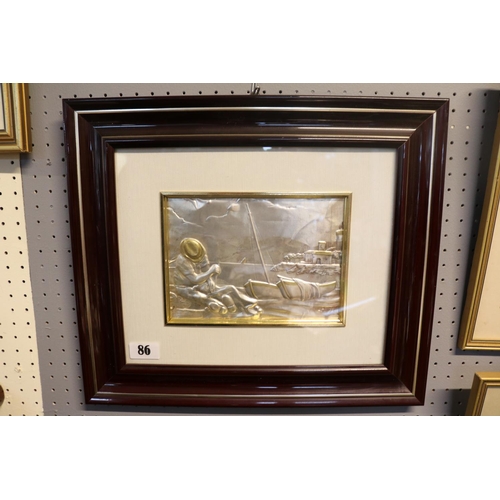 86 - Framed and mounted Silver plaque depicting a Mediterranean fisherman mending nets against shoreline ... 