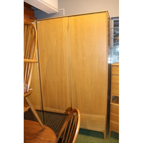 392 - Ercol Rimini Double wardrobe with single drawer to base