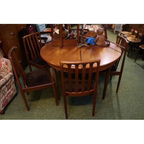 397 - Teak Meredew Circular table on tapering legs with a set of 4 upholstered chairs