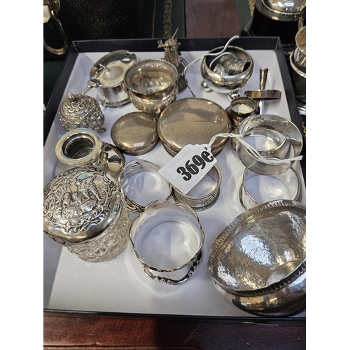 369E - Tray of assorted Silver Napkin rings, Silver topped powder pot, Salts etc