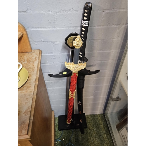 252L - The Sword of the God of War and a Samurai Sword with stand