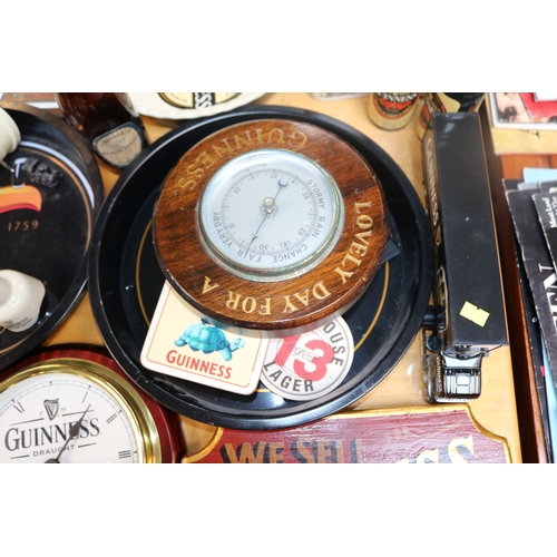 315 - Good collection of Guinness related items inc. Cast Metal Trivet, Advertising clock, Trays etc