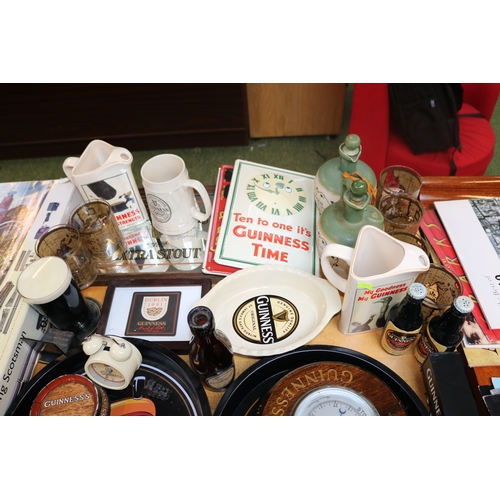 315 - Good collection of Guinness related items inc. Cast Metal Trivet, Advertising clock, Trays etc