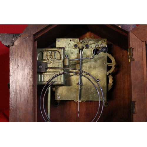 74 - Edwardian domed top Mantel clock with numeral dial and inlaid shell motif with key