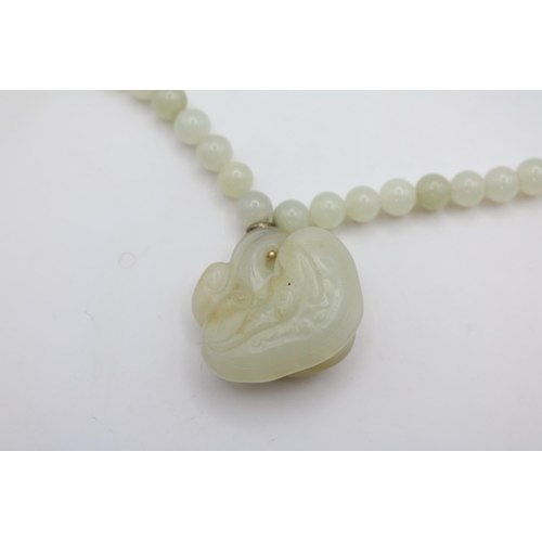 145 - Fine Chinese Celadon Jade oval Gourd necklace mounted on Celadon Jade beaded necklace. Pendant 4cm i... 