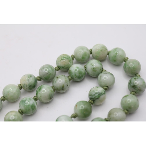 147 - Long Jade hand knotted Polished Green and Celadon Bead necklace on white metal clasp with carved Jad... 