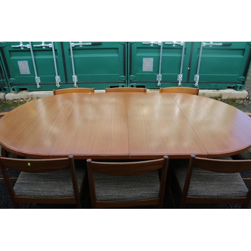 192 - MacIntosh Mid Century Oval table with chairs 2 leaves supported on out swept legs. 220cm in Length