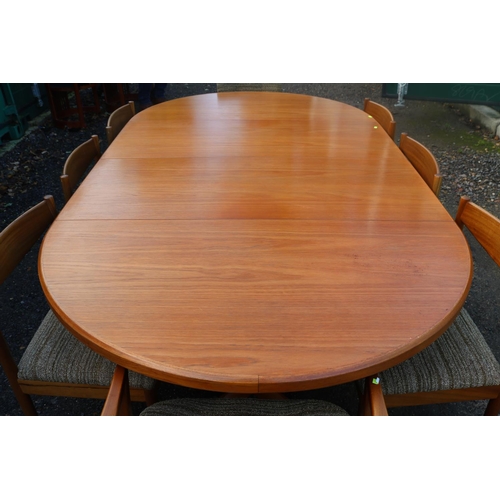 192 - MacIntosh Mid Century Oval table with chairs 2 leaves supported on out swept legs. 220cm in Length