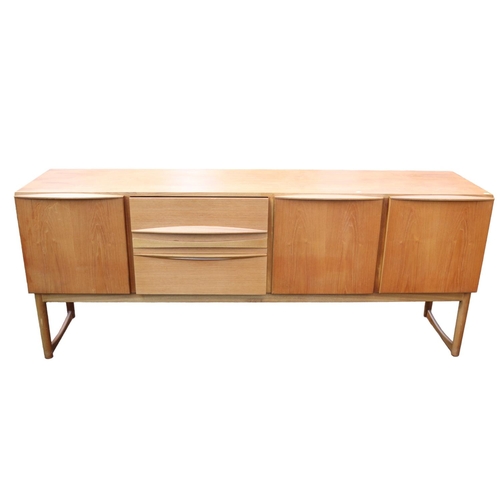 193 - A H MacIntosh of Kirkcaldy Mid Century Teak Sideboard of 3 drawers flanked by cupboards on straight ... 