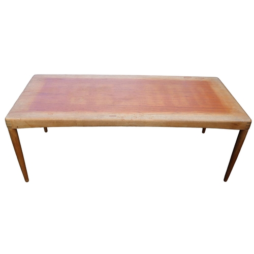 210 - Bramin Henry Klein Danish Teak Coffee table on tapering legs. 135cm in Length by 59cm in Width by 50... 