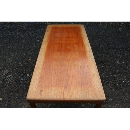 210 - Bramin Henry Klein Danish Teak Coffee table on tapering legs. 135cm in Length by 59cm in Width by 50... 