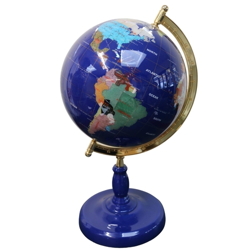 105 - Large Gemstone Semi Precious Globe with brass support over blue pedestal base. 60cm in Height