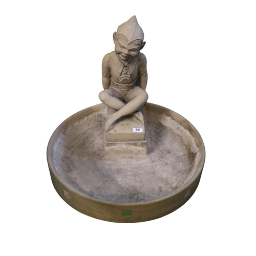 Rare Doulton Lambeth stoneware Bird Bath figure designed by Harry Simeon. Puck modelled seated crossed legs, on separate circular bird bath base, stamped Doulton regd 736777. 53cm in Height by 60cm in Diameter. Reference Desmond Eyles & Louise Irvine Doulton Lambeth Wares page 194.