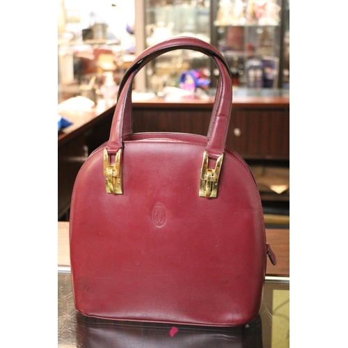 61 - Vintage 1980s Cartier Burgundy satchel type handbag with brass fittings 26cm in Width