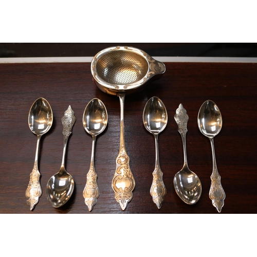 275 - European White Metal Tea Strainer and a set 6 Matching spoons with with engraved detail. 170g total ... 