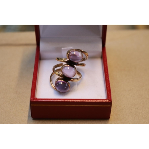 294 - Ladies 9ct Gold Cabochon amethyst rob over set finger line ring. 6.1g total weight Size N