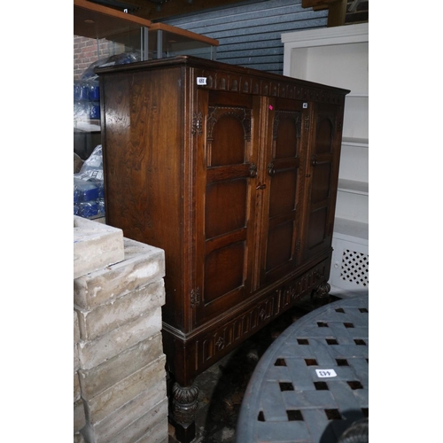 447 - Oak Panel front Drinks cabinet on carved baluster supports