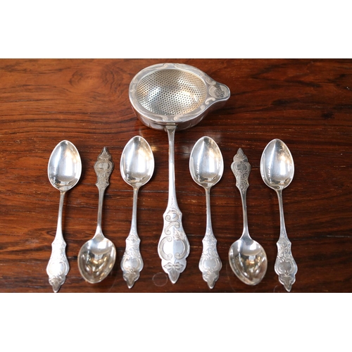 321 - European White Metal Tea Strainer and a set 6 Matching spoons with with engraved detail. 170g total ... 