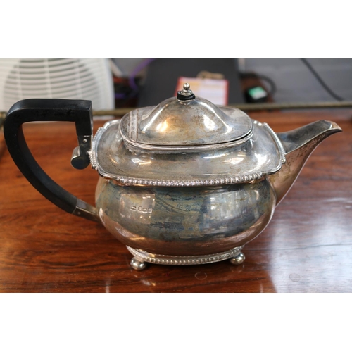 346 - Early 20thC Silver Teapot with ebonised handle over ball feet Sheffield 1923 938g total weight