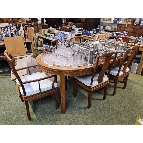 407 - 20thC Chinese Hardwood Oval dining table with 2 leaves and a set of 6 dining chairs