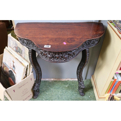 446 - Heavily Carved Anglo Indian serpentine fronted hall table over 2 outstretched legs