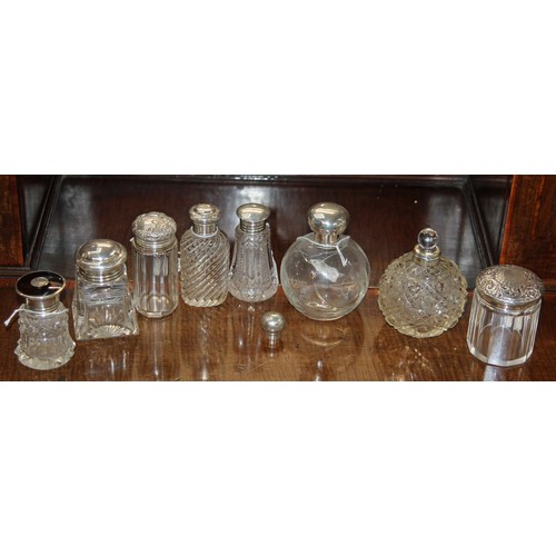 383 - Collection of eight Silver Topped Cut Glass Dressing Table Bottles including: Fluted shaped glass wi... 