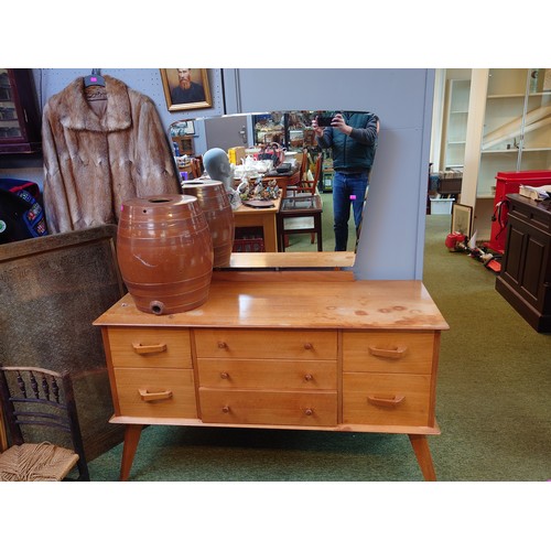 401 - Mid Century Walnut Dressing table of Seven drawers over splayed legs and mirror to back