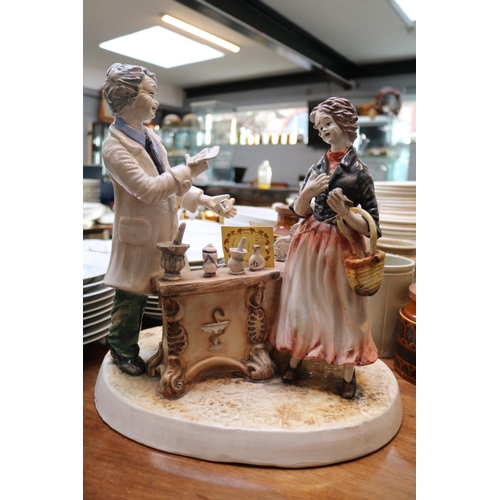 161A - Large Capodimonte figural group of the Pharmacist with original paper label